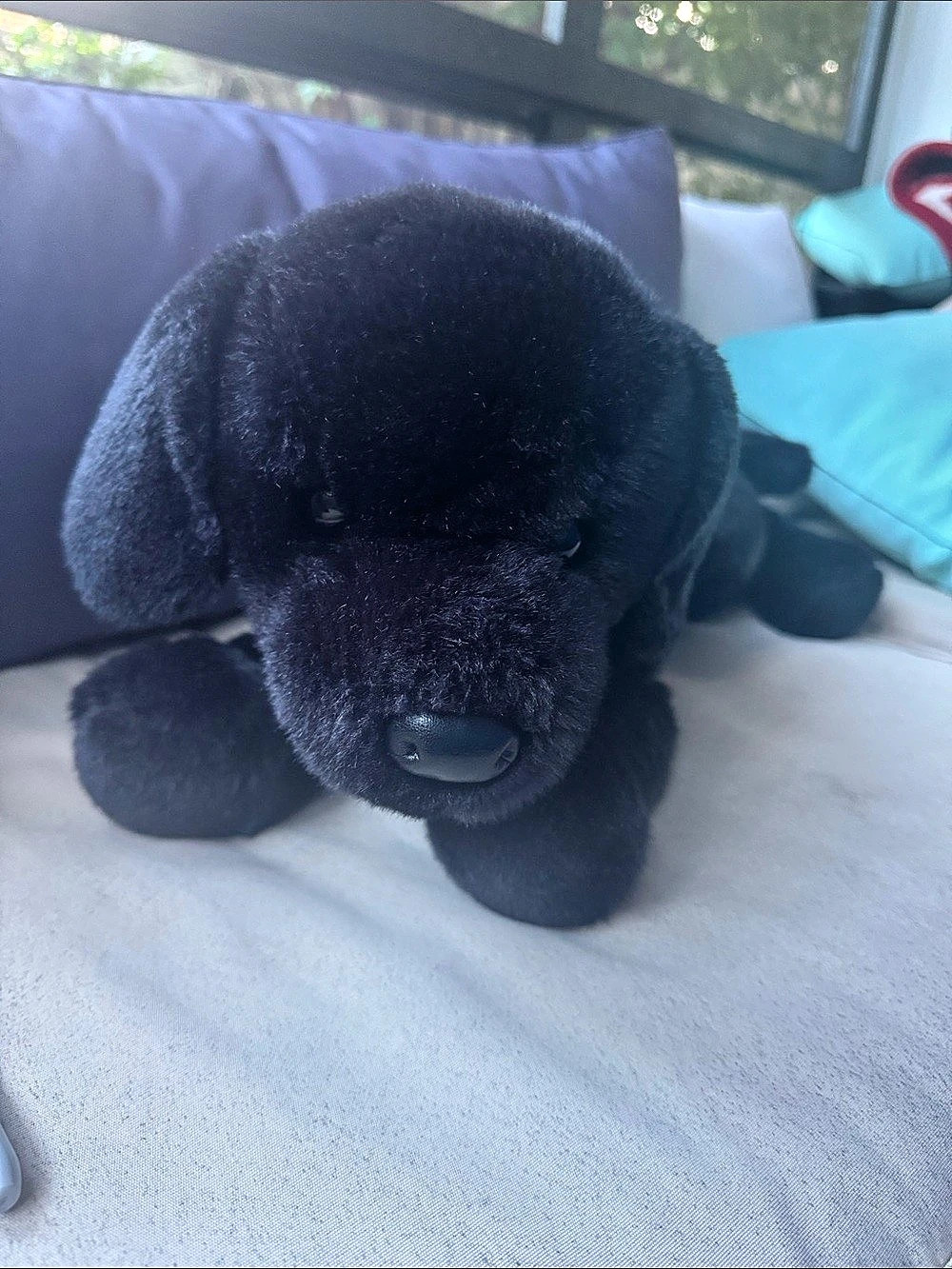 Cuddly black dog stuffed animal from the Black Dog catalog